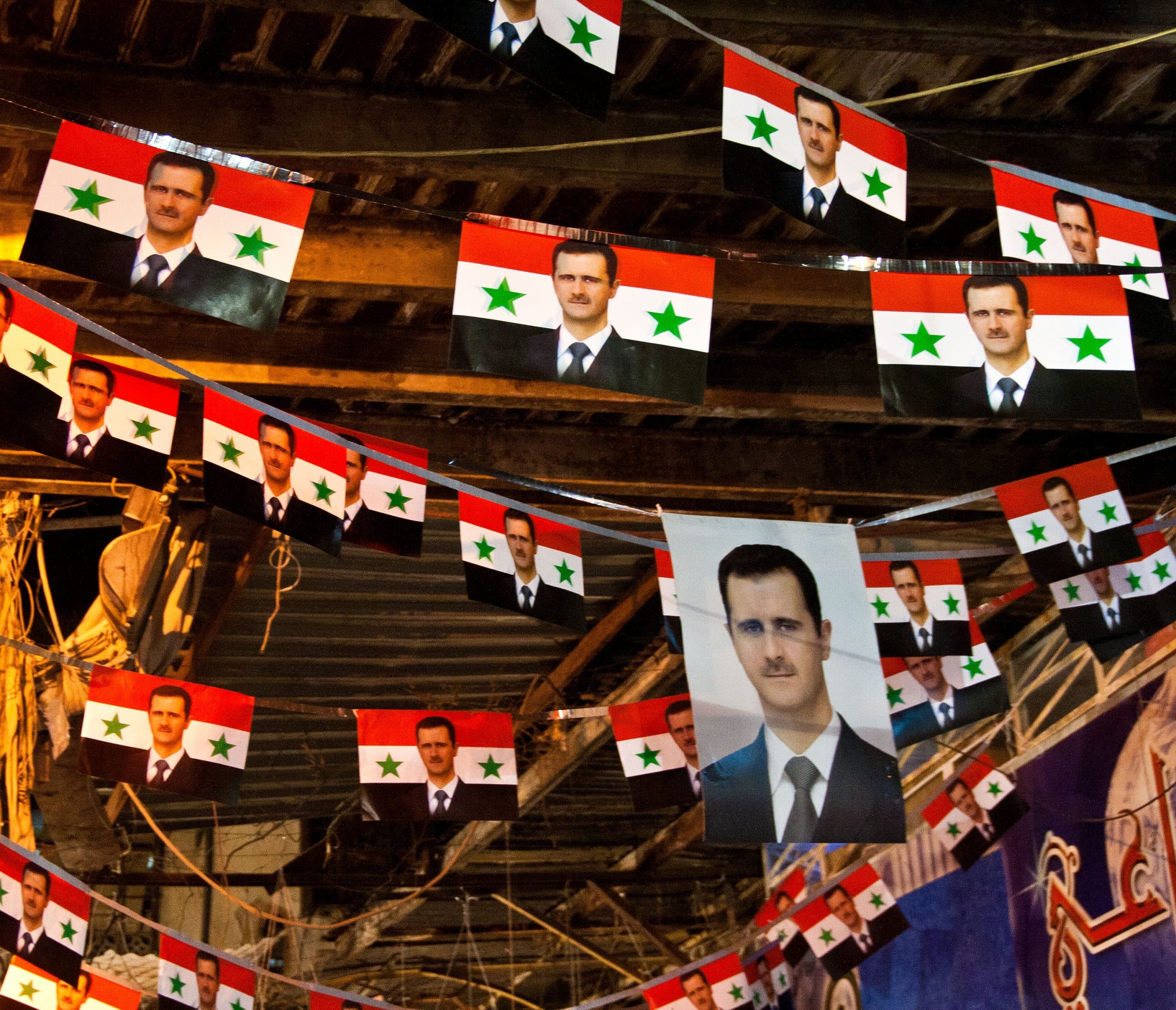 Article Image - Syrian Flags and Assad's Photos